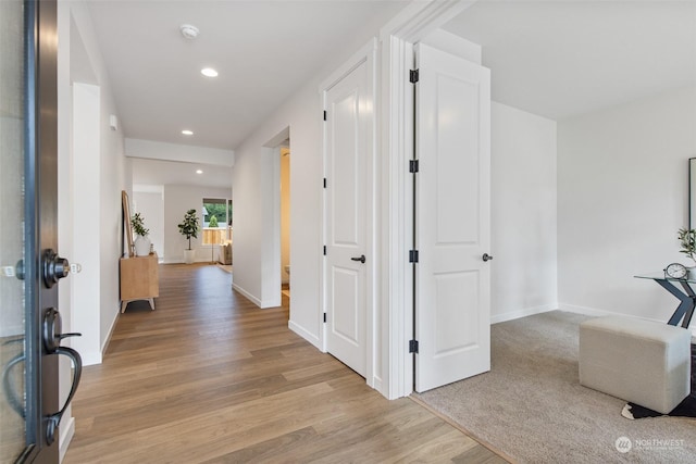 corridor featuring light wood-type flooring