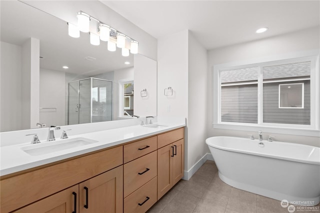 bathroom featuring vanity, separate shower and tub, and tile patterned flooring