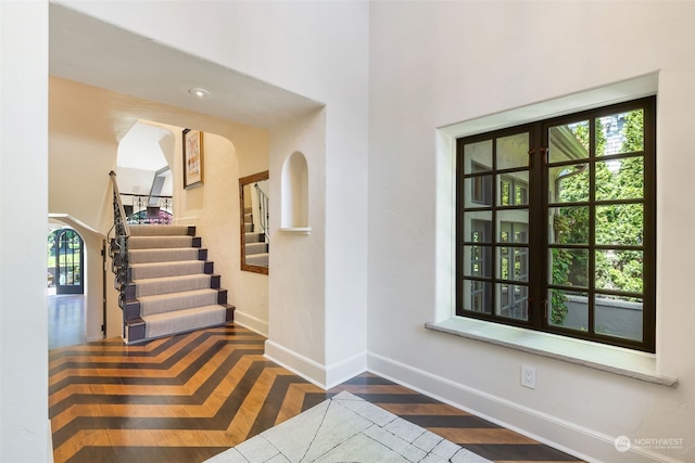 entrance foyer with dark hardwood / wood-style floors