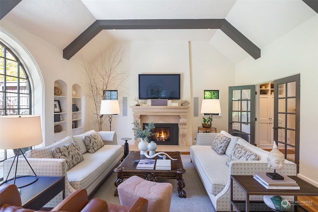 living room featuring vaulted ceiling and built in features