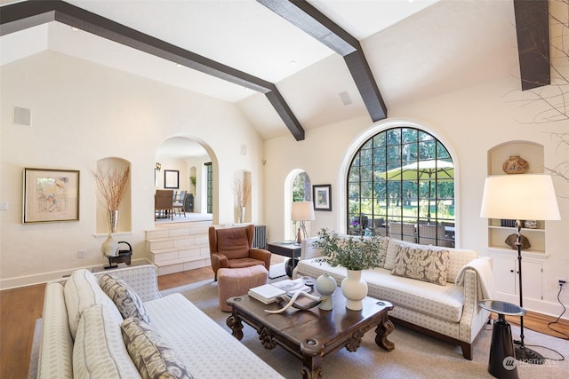 living room with wood-type flooring and lofted ceiling with beams