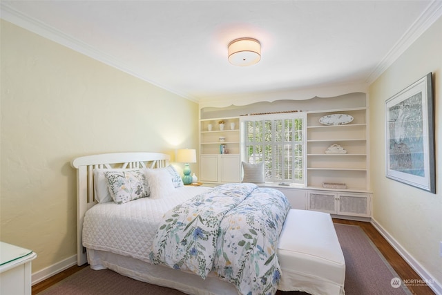 bedroom with dark wood-type flooring and crown molding