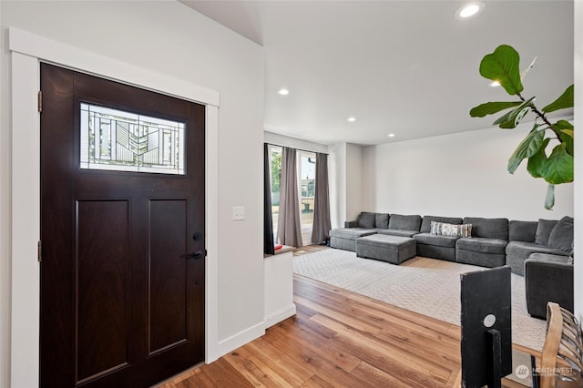 foyer entrance with light wood-type flooring