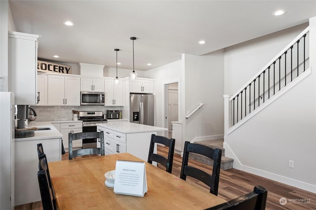 dining space featuring light hardwood / wood-style floors and sink