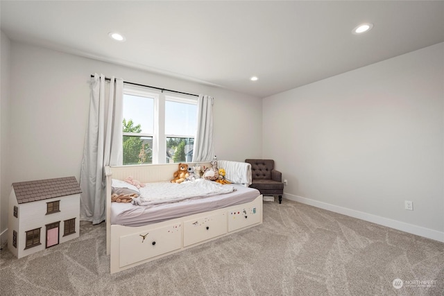 bedroom with light colored carpet