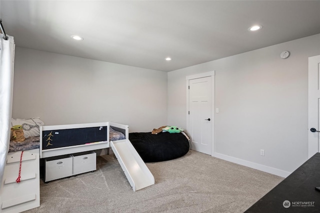 bedroom featuring light colored carpet