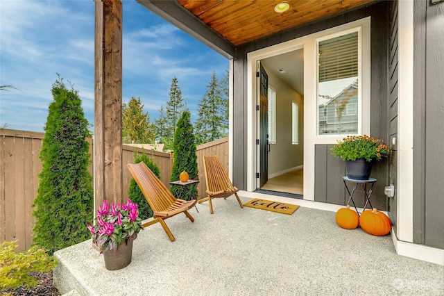 sunroom with wooden ceiling