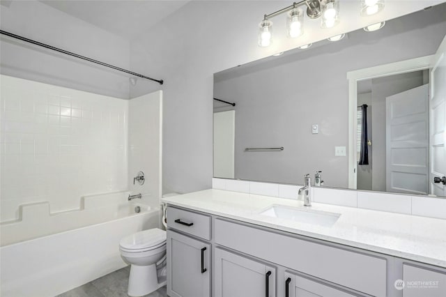 full bathroom with tub / shower combination, tile patterned floors, toilet, and vanity