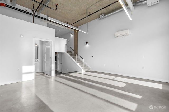 garage featuring an AC wall unit