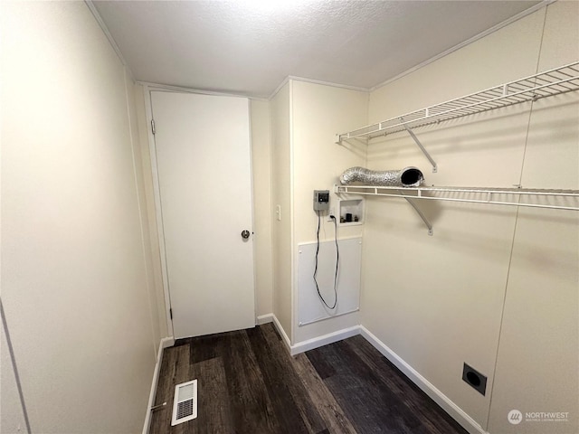 washroom featuring washer hookup, dark hardwood / wood-style floors, and hookup for an electric dryer