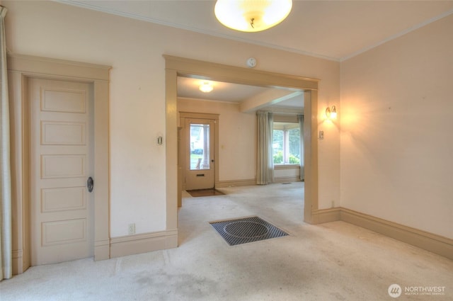 interior space with crown molding and baseboards