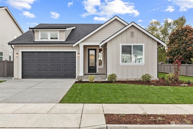 view of front facade featuring a garage and a front yard