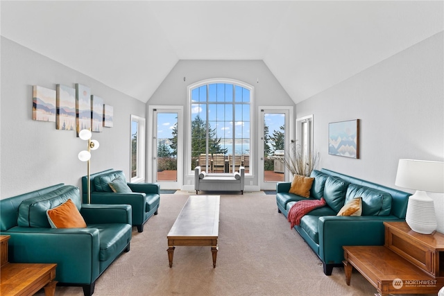 carpeted living room featuring vaulted ceiling