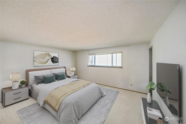 carpeted bedroom featuring a textured ceiling