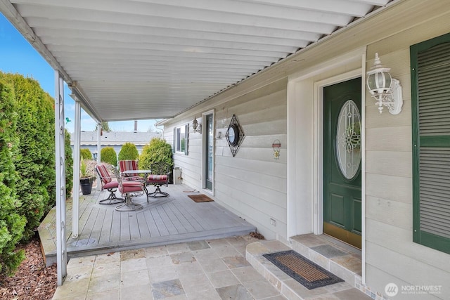 wooden deck featuring outdoor dining space