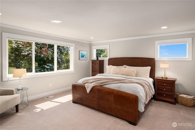 bedroom with light carpet and ornamental molding