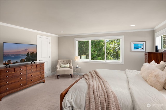 bedroom with light colored carpet and crown molding