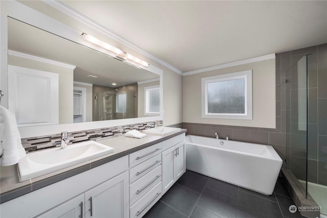 bathroom with tile patterned floors, vanity, shower with separate bathtub, backsplash, and crown molding