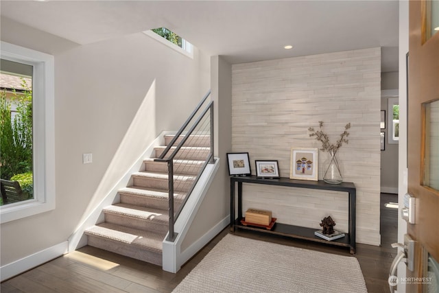 stairway featuring hardwood / wood-style flooring