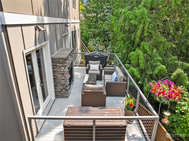 balcony with an outdoor living space and french doors