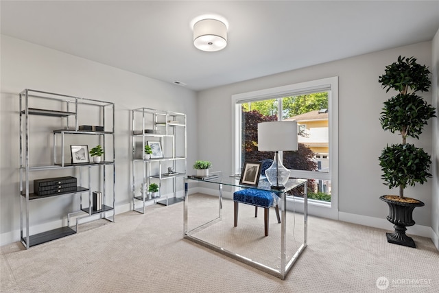 carpeted office with baseboards and visible vents
