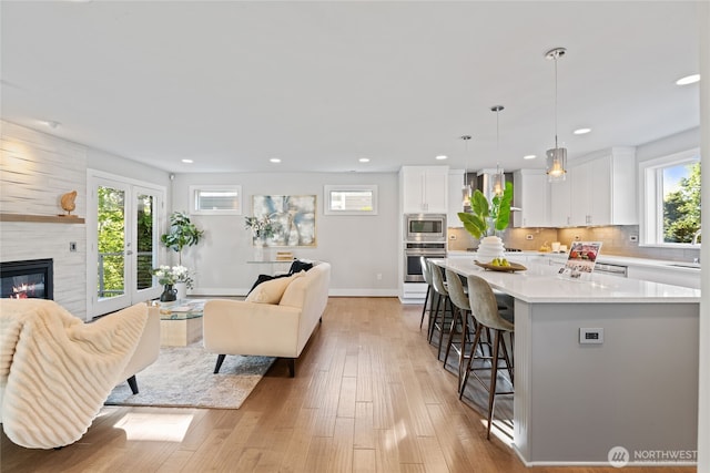 living room featuring recessed lighting and light wood-type flooring
