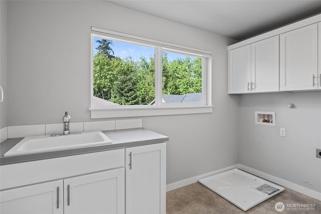 laundry room with a healthy amount of sunlight, electric dryer hookup, cabinet space, a sink, and hookup for a washing machine