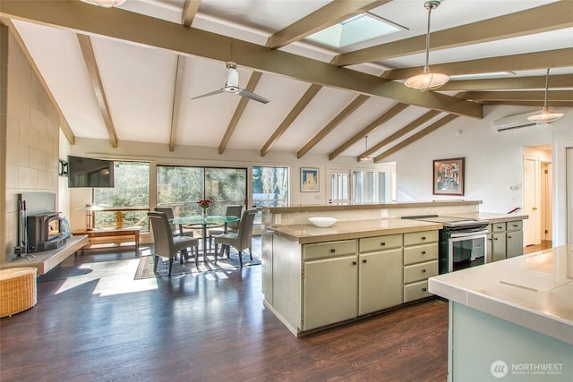 kitchen with a wood stove, dark wood-type flooring, stainless steel electric range, light countertops, and vaulted ceiling with beams