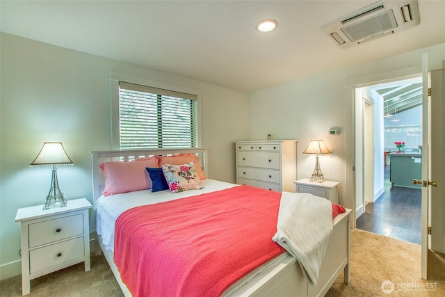 carpeted bedroom with baseboards