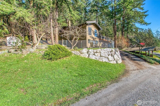 exterior space with aphalt driveway and stairway