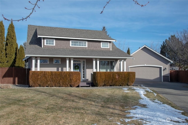 view of front of home with a garage and a front lawn