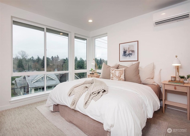 bedroom featuring an AC wall unit