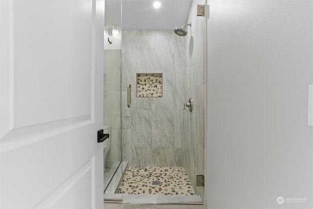 full bathroom featuring a marble finish shower