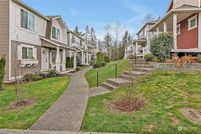 view of property's community featuring a yard