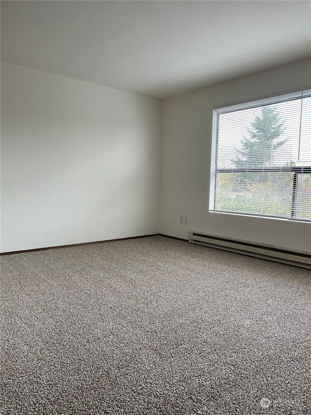 empty room with a baseboard heating unit