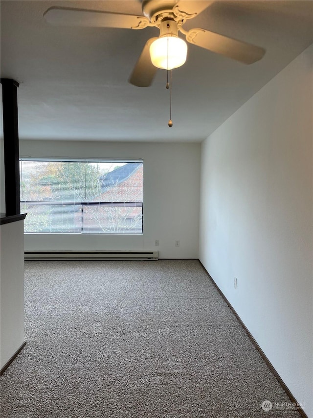 spare room featuring a baseboard radiator, ceiling fan, and carpet flooring