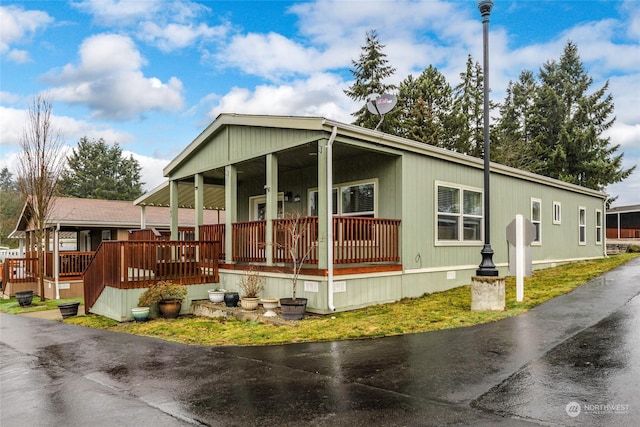 view of side of property with a porch