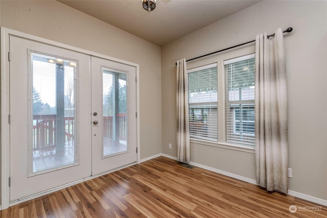 doorway to outside featuring light wood-type flooring and french doors