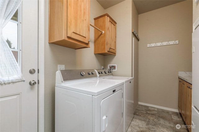 laundry area featuring cabinets and washer and dryer