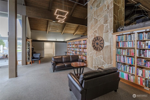 living area with lofted ceiling with beams, wood ceiling, and carpet flooring