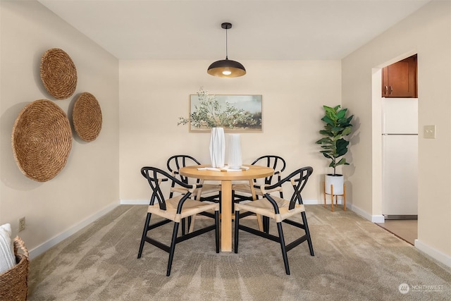 view of carpeted dining area