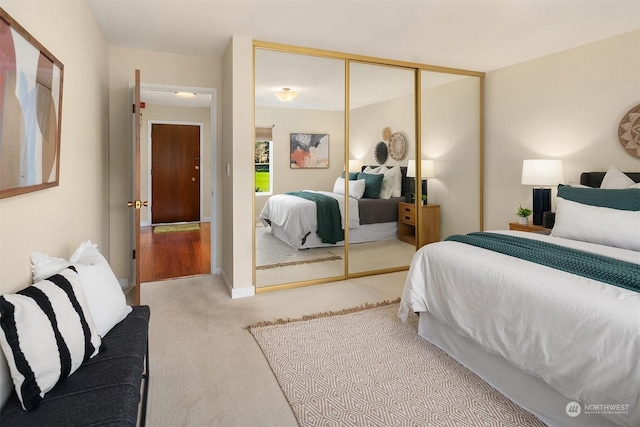 carpeted bedroom with a closet