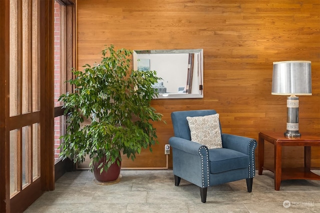 sitting room with wood walls