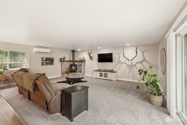 living room featuring a wall mounted air conditioner, light colored carpet, and a wood stove