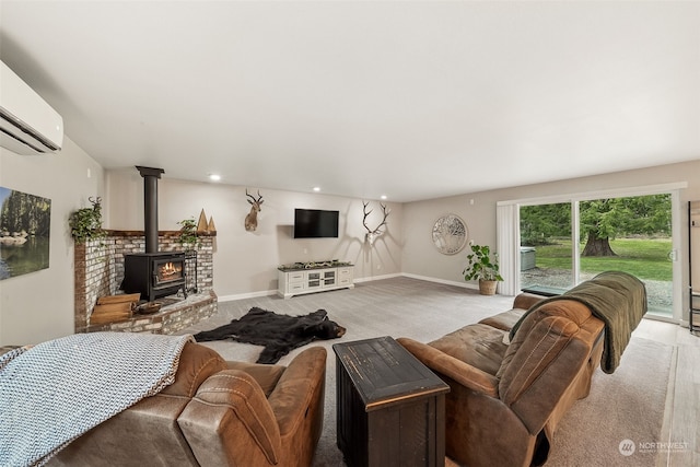 living room featuring a wall mounted AC and a wood stove