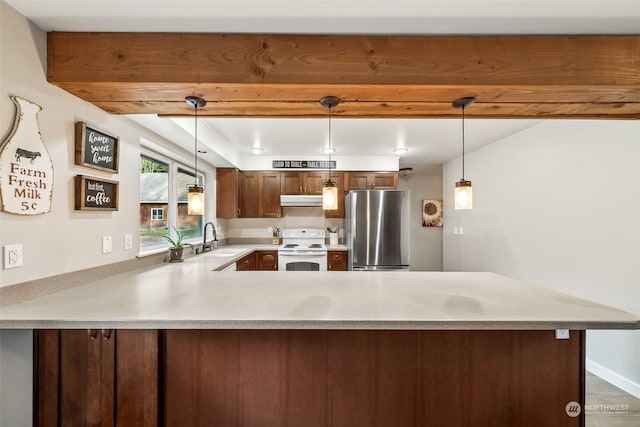 kitchen featuring white electric stove, hanging light fixtures, stainless steel fridge, and kitchen peninsula