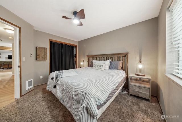 carpeted bedroom with ceiling fan