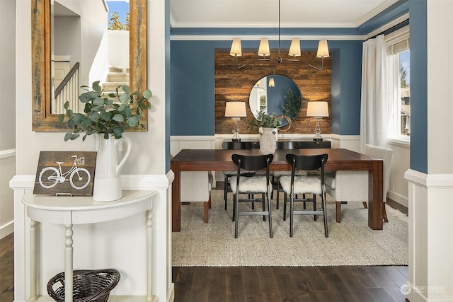 dining area with crown molding and dark hardwood / wood-style flooring