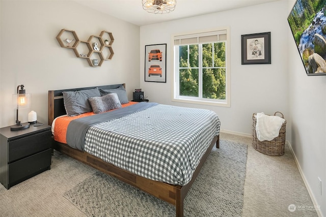 bedroom with light colored carpet