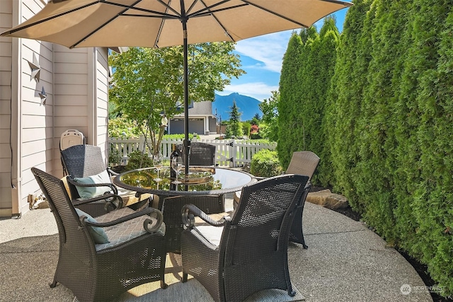 view of patio / terrace featuring a mountain view